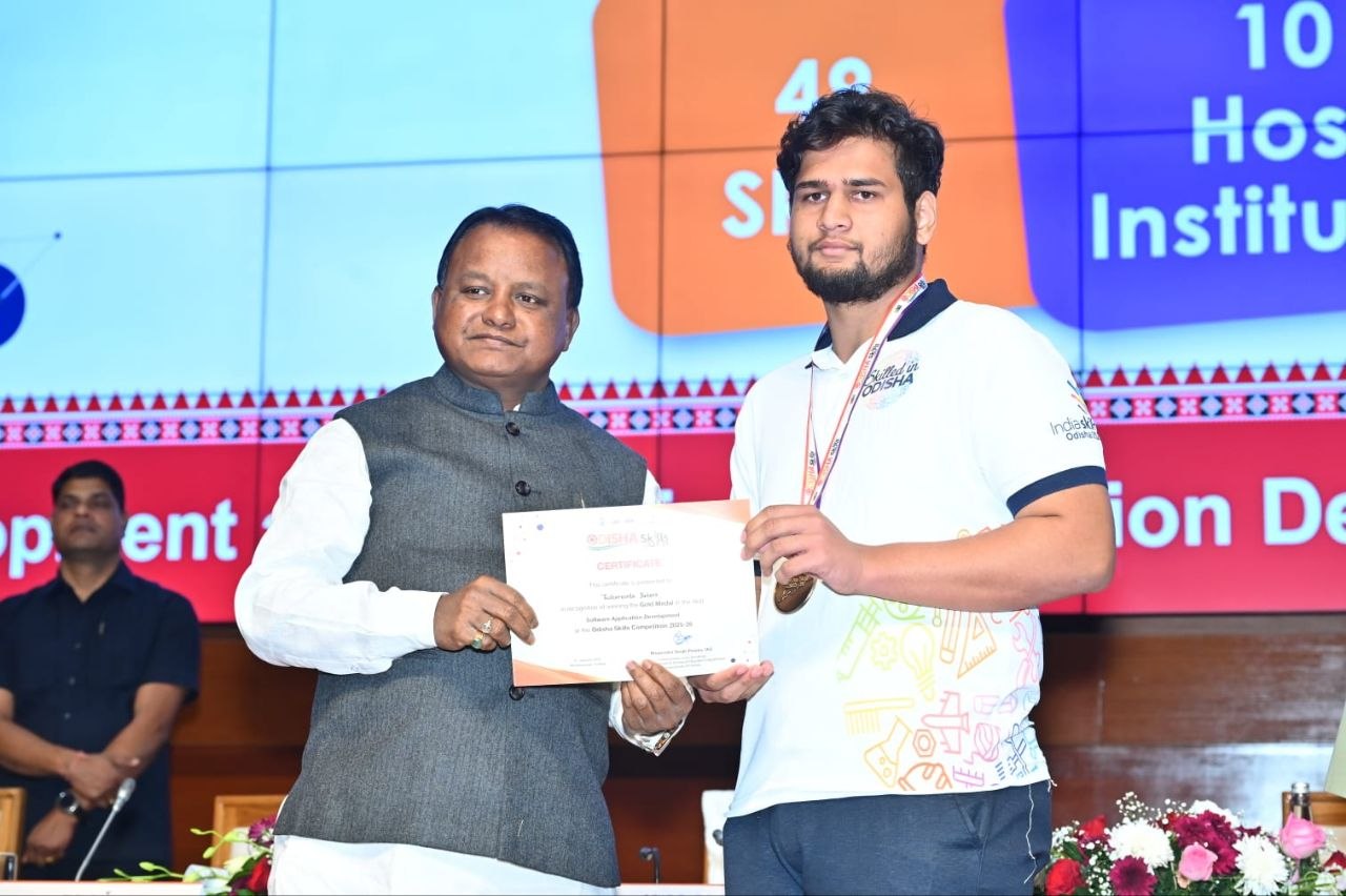 Receiving Odisha Skills gold medal and certificate